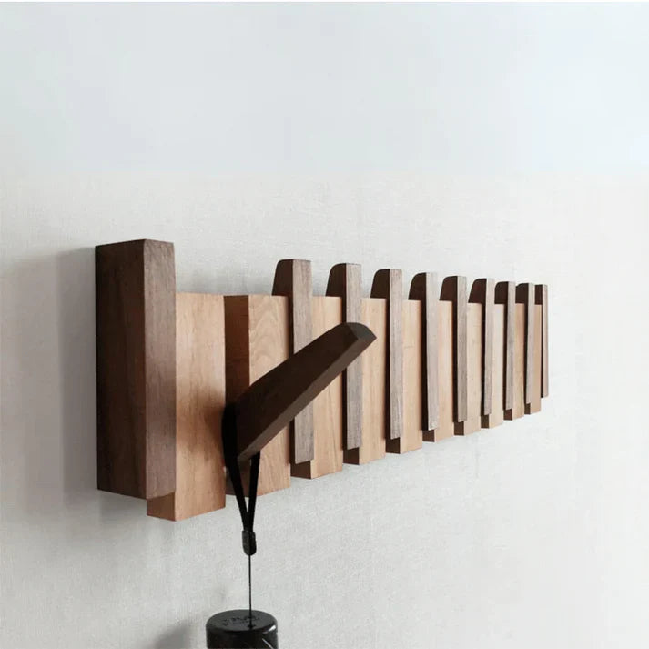 "Artistieke houten kapstok met piano design, elegante uitstraling, 4-8 haken, gemaakt van beuken- en walnotenhout."