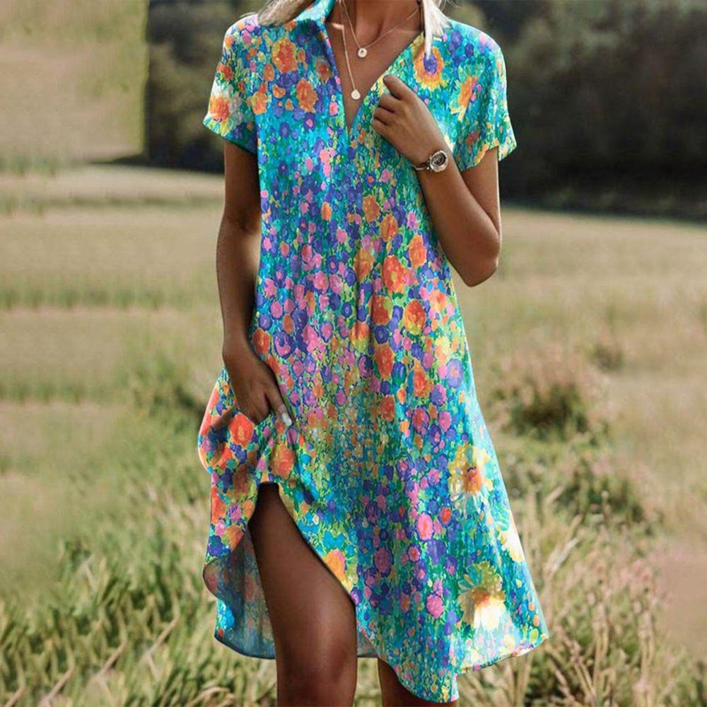 "Ayla Boho zomerjurk met bloemenprint en A-lijn model, elegante midi-lengte, perfect voor zomerse gelegenheden."