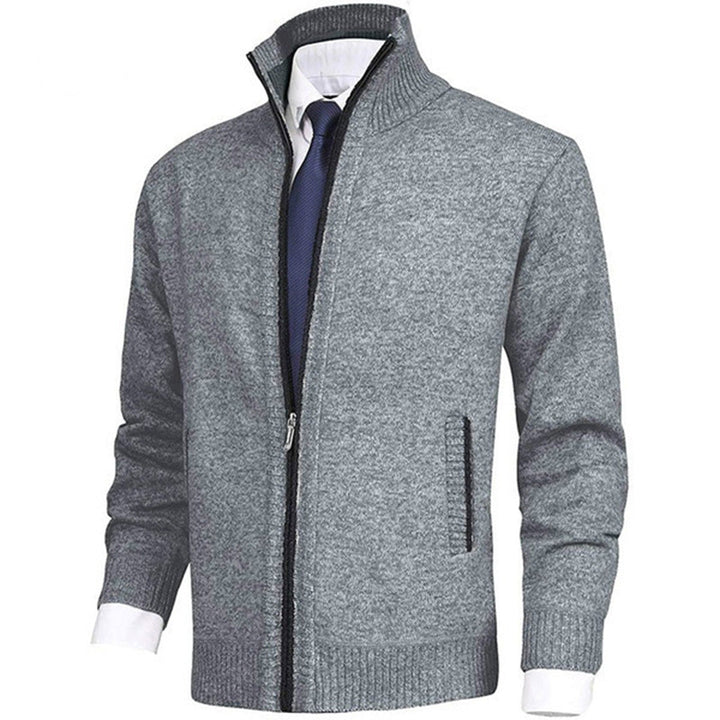 "Blauw herenvest van hoogwaardige fleece met rits en hoge kraag, perfect voor lente. Warm en veelzijdig ontwerp."
