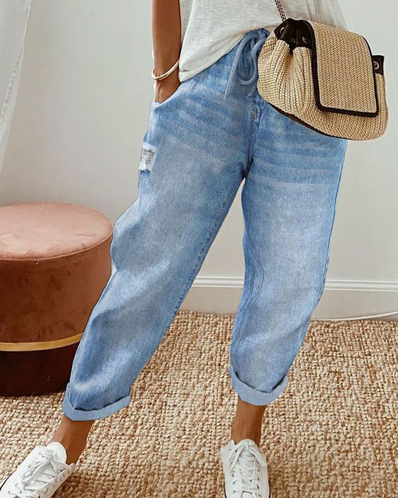 "Blauwe jeans dames met zakken en medium taille, casual stijl voor dagelijks comfort."