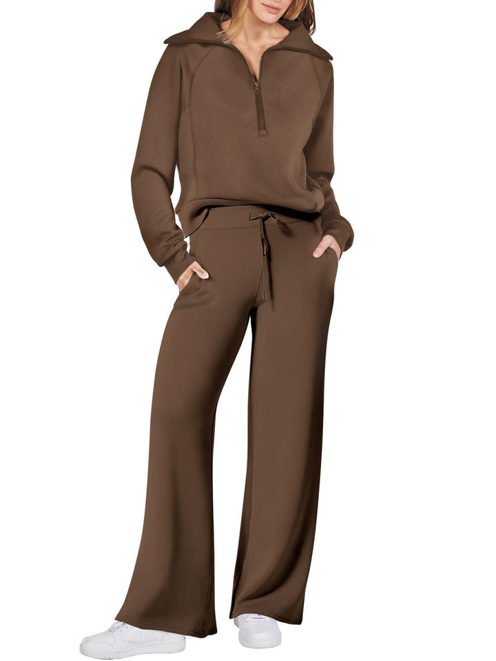 Comfortabele tweedelige damesoutfit met lange mouwen, ritssluiting en diverse kleuren. Ideaal voor dagelijks comfort.