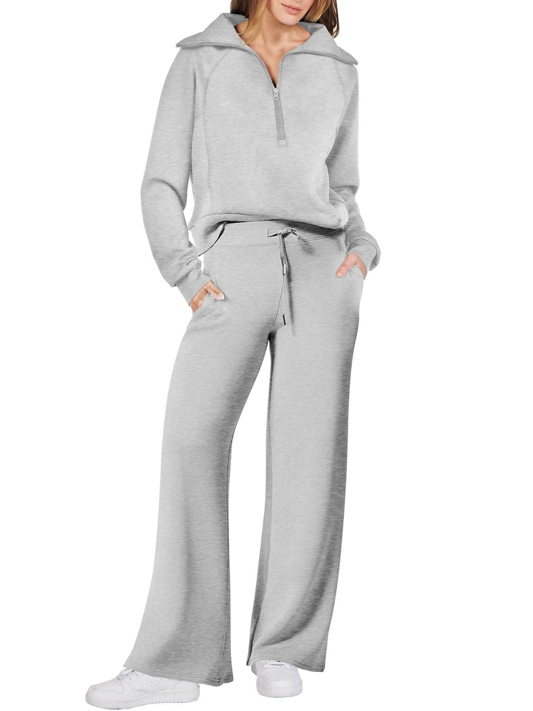 Comfortabele tweedelige damesoutfit met lange mouwen, ritssluiting en diverse kleuren. Ideaal voor dagelijks comfort.