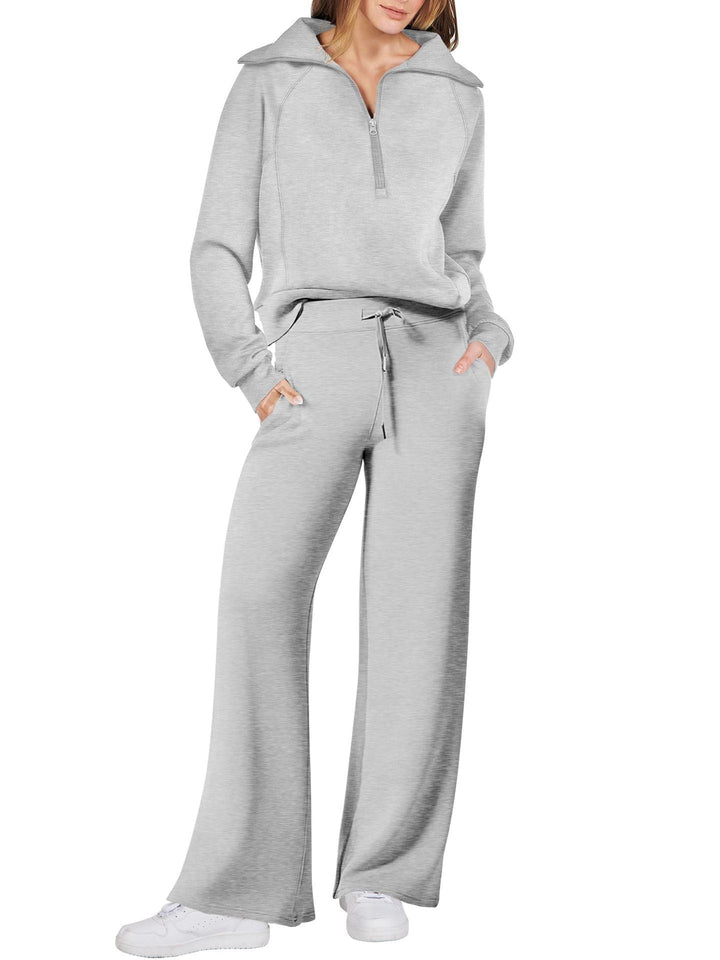 Comfortabele tweedelige damesoutfit met lange mouwen, ritssluiting en diverse kleuren. Ideaal voor dagelijks comfort.