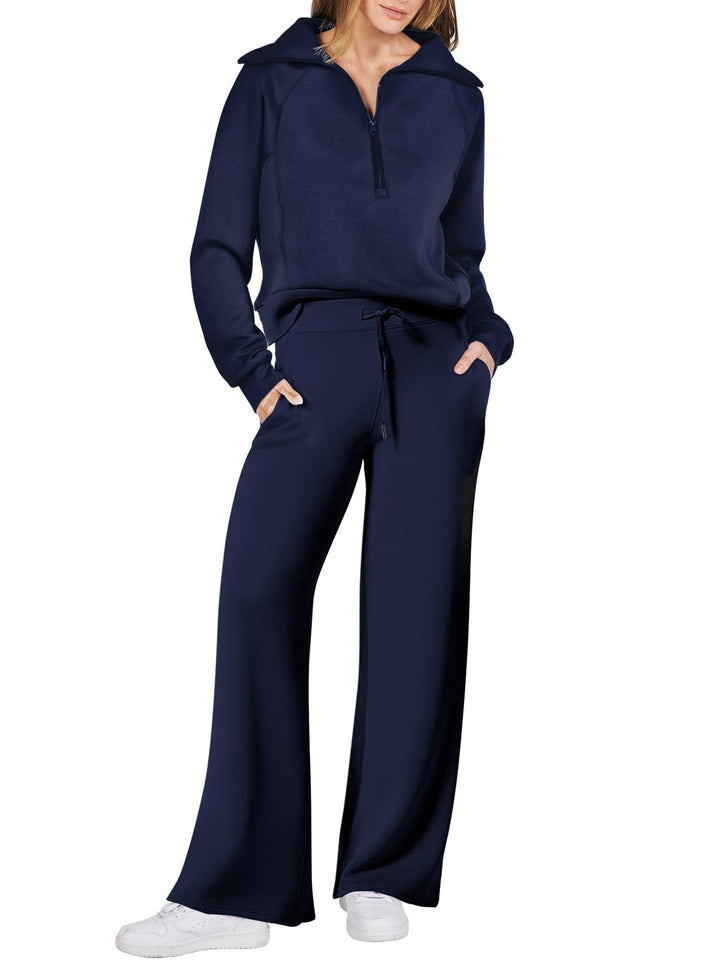 Comfortabele tweedelige damesoutfit met lange mouwen, ritssluiting en diverse kleuren. Ideaal voor dagelijks comfort.