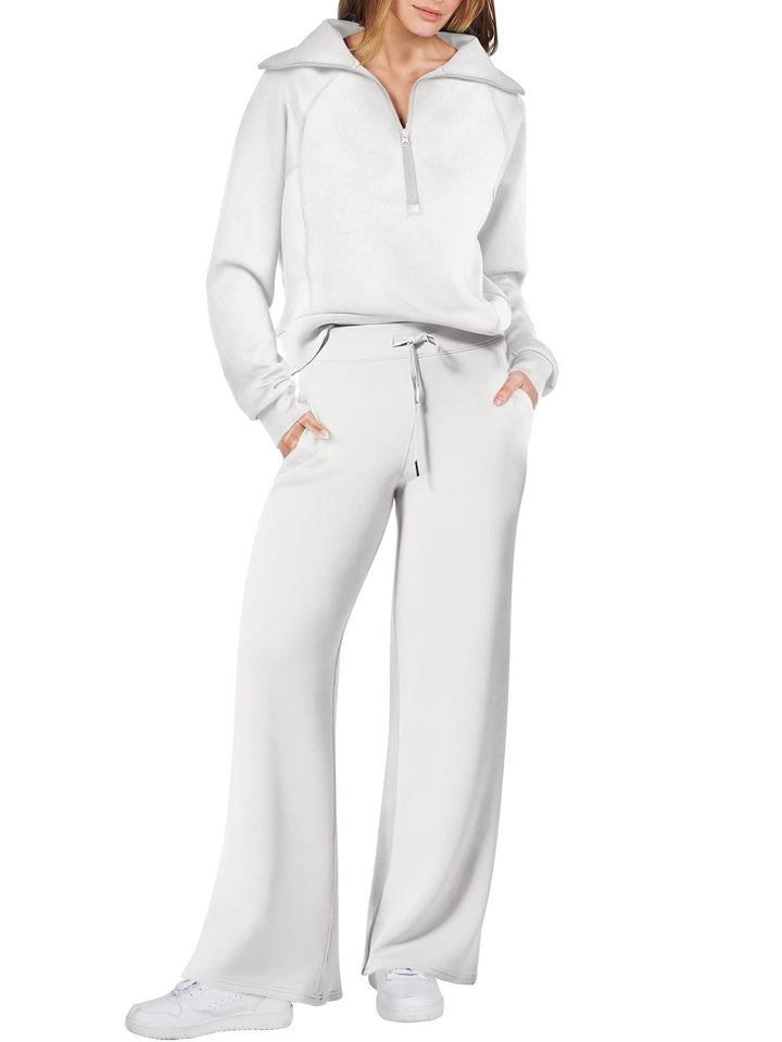 Comfortabele tweedelige damesoutfit met lange mouwen, ritssluiting en diverse kleuren. Ideaal voor dagelijks comfort.