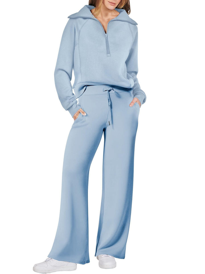 Comfortabele tweedelige damesoutfit met lange mouwen, ritssluiting en diverse kleuren. Ideaal voor dagelijks comfort.