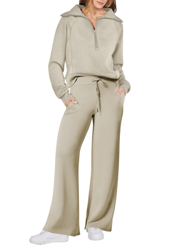 Comfortabele tweedelige damesoutfit met lange mouwen, ritssluiting en diverse kleuren. Ideaal voor dagelijks comfort.