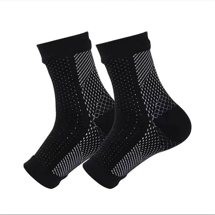 "Comfortabele unisex compressiekous, zwart, enkelhoogte, voor pijnverlichting en steun bij neuropathie en fasciitis."