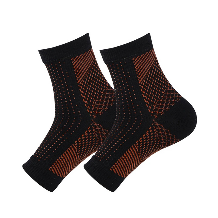 "Comfortabele unisex compressiekous, zwart, enkelhoogte, voor pijnverlichting en steun bij neuropathie en fasciitis."