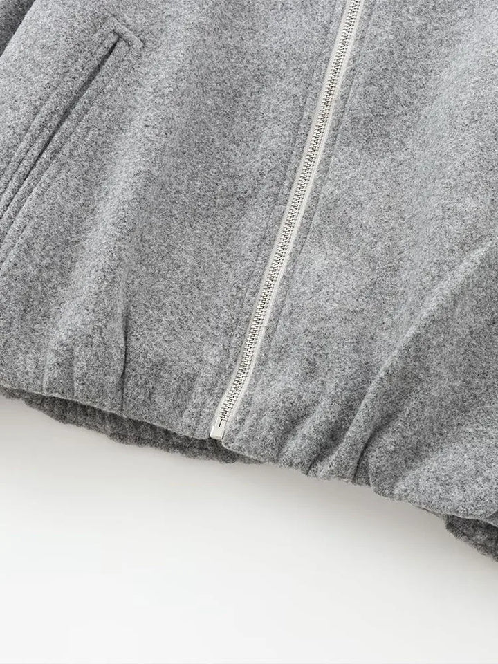 "Dames grijze bomberjas met ritssluiting, elastische tailleband en moderne oversized fit voor een stijlvolle casual look."