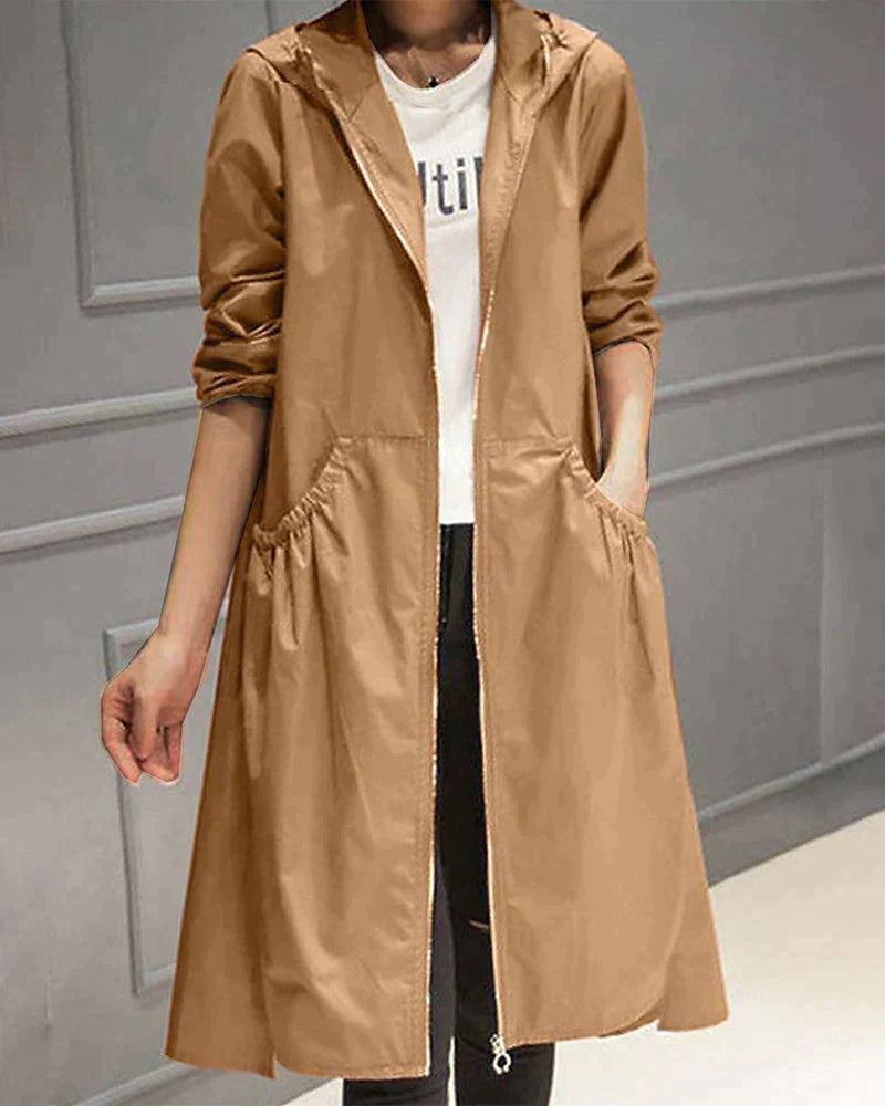 "Dames lange beige regenjas, waterdicht, knielang, losse pasvorm, perfecte stijl en bescherming tegen regen en wind."