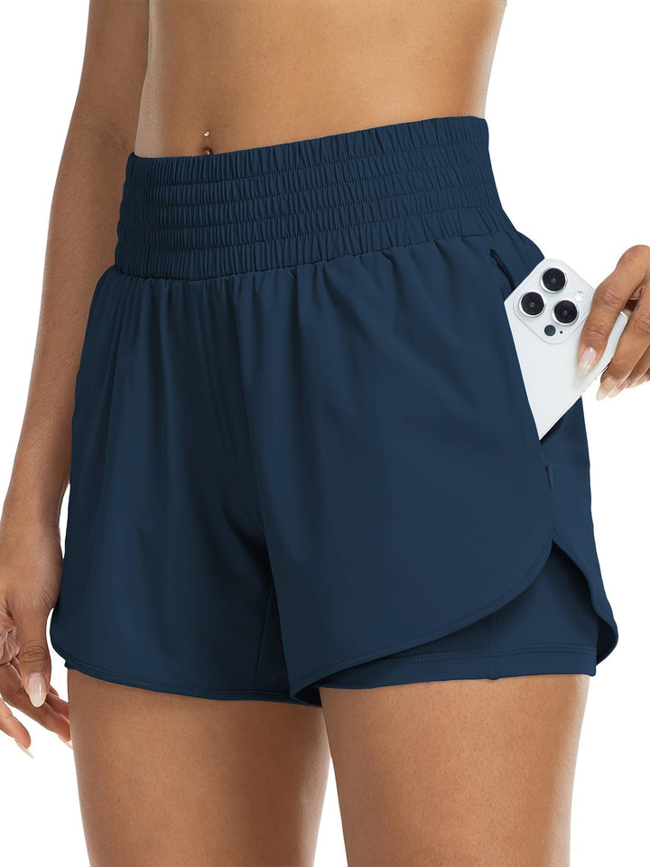 "Dames trainingsshorts met hoge taille, 2-in-1 ontwerp, losse buitenlaag en elastische binnenlaag, ademende stof."