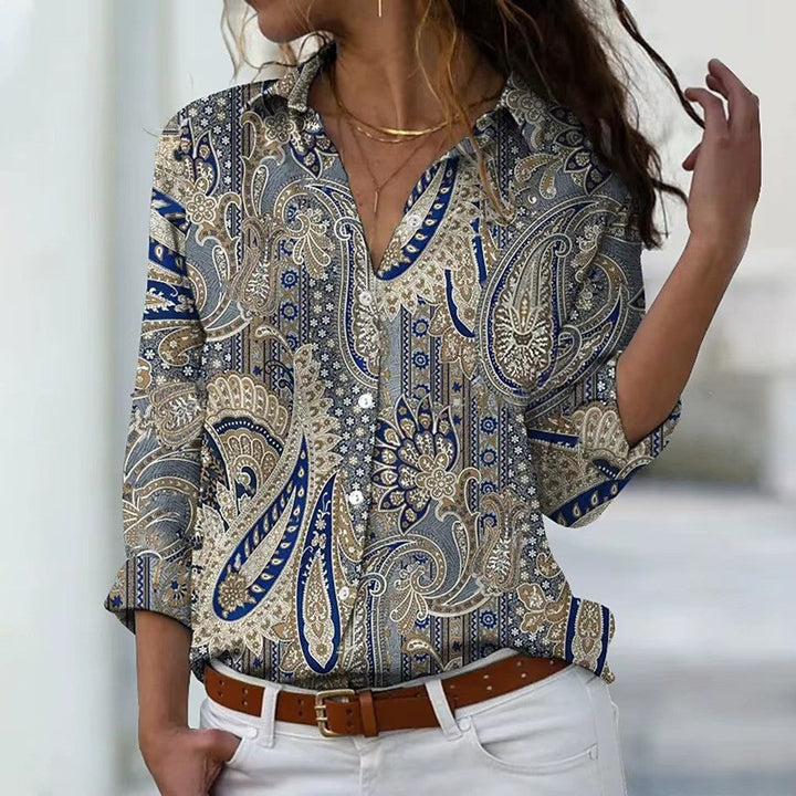 "Dames zomerbloes met lange mouwen, bloemenprint, zachte stof. Perfect voor zomerdagen; vrouwelijk en stijlvol ontwerp."