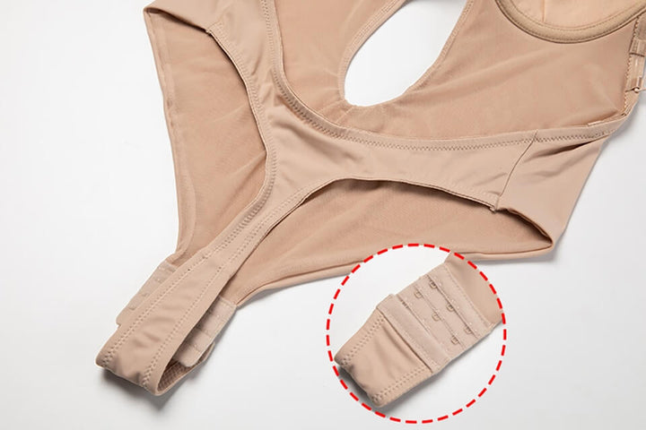 "Diepe V rugloze body shaper voor dames, naadloos en comfortabel, onzichtbaar onder kleding, open rug ontwerp, beige kleur."