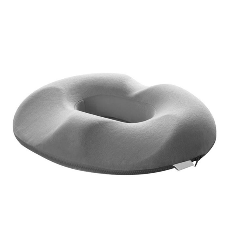 "Donutvormig stuitkussen voor aambeien, ergonomisch ontwerp, strategische openingen voor drukverlichting en maximaal comfort.
