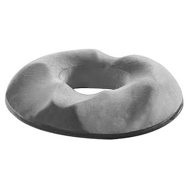 "Donutvormig stuitkussen voor aambeien, ergonomisch ontwerp, strategische openingen voor drukverlichting en maximaal comfort.