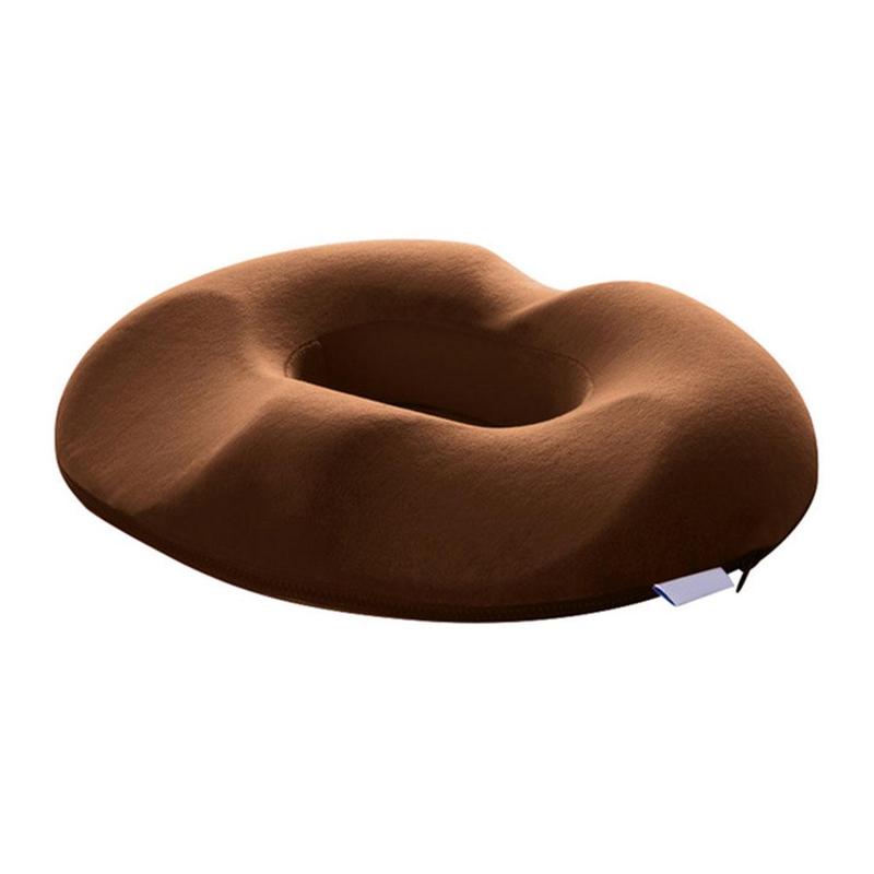 "Donutvormig stuitkussen voor aambeien, ergonomisch ontwerp, strategische openingen voor drukverlichting en maximaal comfort.