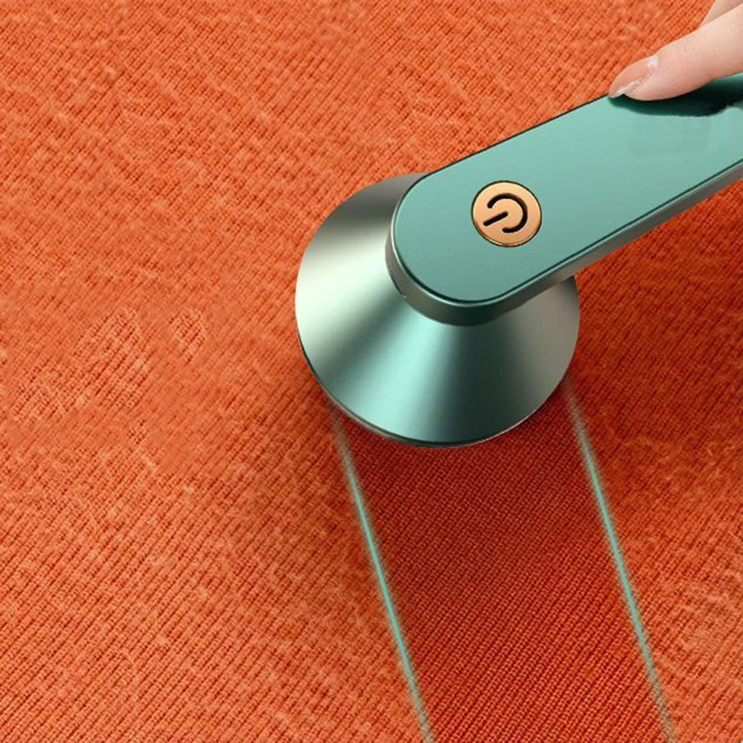 "Draadloze pluizenverwijderaar voor kleding, kleurrijk en compact ontwerp, effectief op diverse stoffen zonder schade."