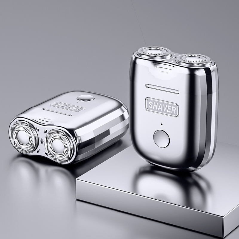 "Draagbaar mini scheerapparaat, compact ontwerp, zilver, ergonomisch, oplaadbaar, geschikt voor gevoelige huid."