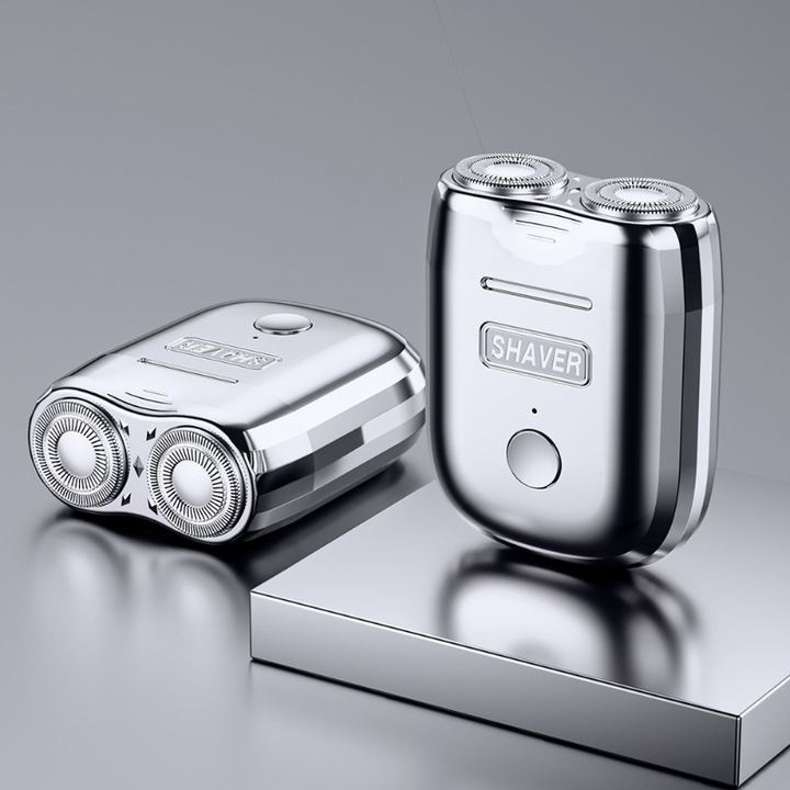 "Draagbaar mini scheerapparaat, compact ontwerp, zilver, ergonomisch, oplaadbaar, geschikt voor gevoelige huid."