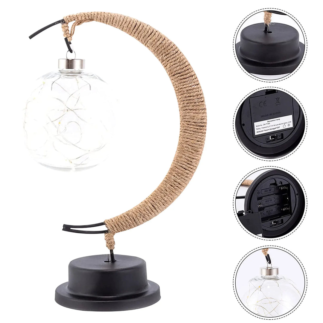 "Dromerige maanlamp van borosilicaatglas met zachte LED-gloed, creëert een betoverende sfeer op tafel."