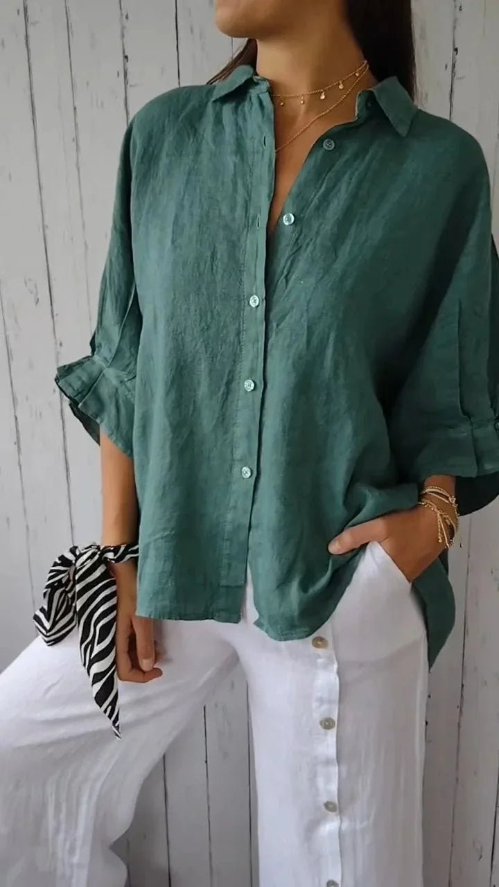 "Elegant linnen damesblouse met V-hals en strikdetail in neutrale kleuren, perfect voor elke gelegenheid."