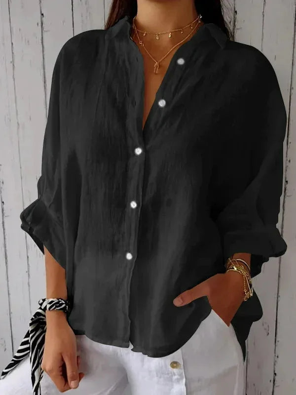 "Elegant linnen damesblouse met V-hals en strikdetail in neutrale kleuren, perfect voor elke gelegenheid."