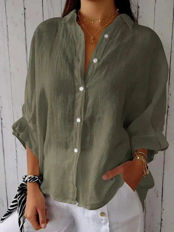 "Elegant linnen damesblouse met V-hals en strikdetail in neutrale kleuren, perfect voor elke gelegenheid."