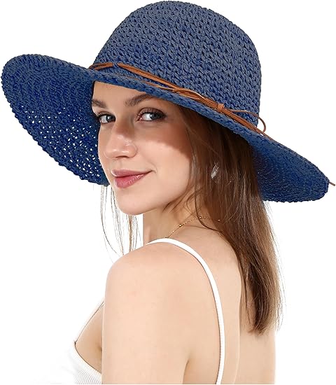 "Elegant opvouwbare zonnehoed voor dames met brede rand, beige tint, biedt UV-bescherming en stijl voor zomerse dagen."