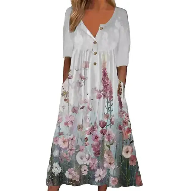 Elegante A-lijn midi jurk met levendige bloemenprint en praktische zakken, ideaal voor zomerse en stijlvolle dagen.