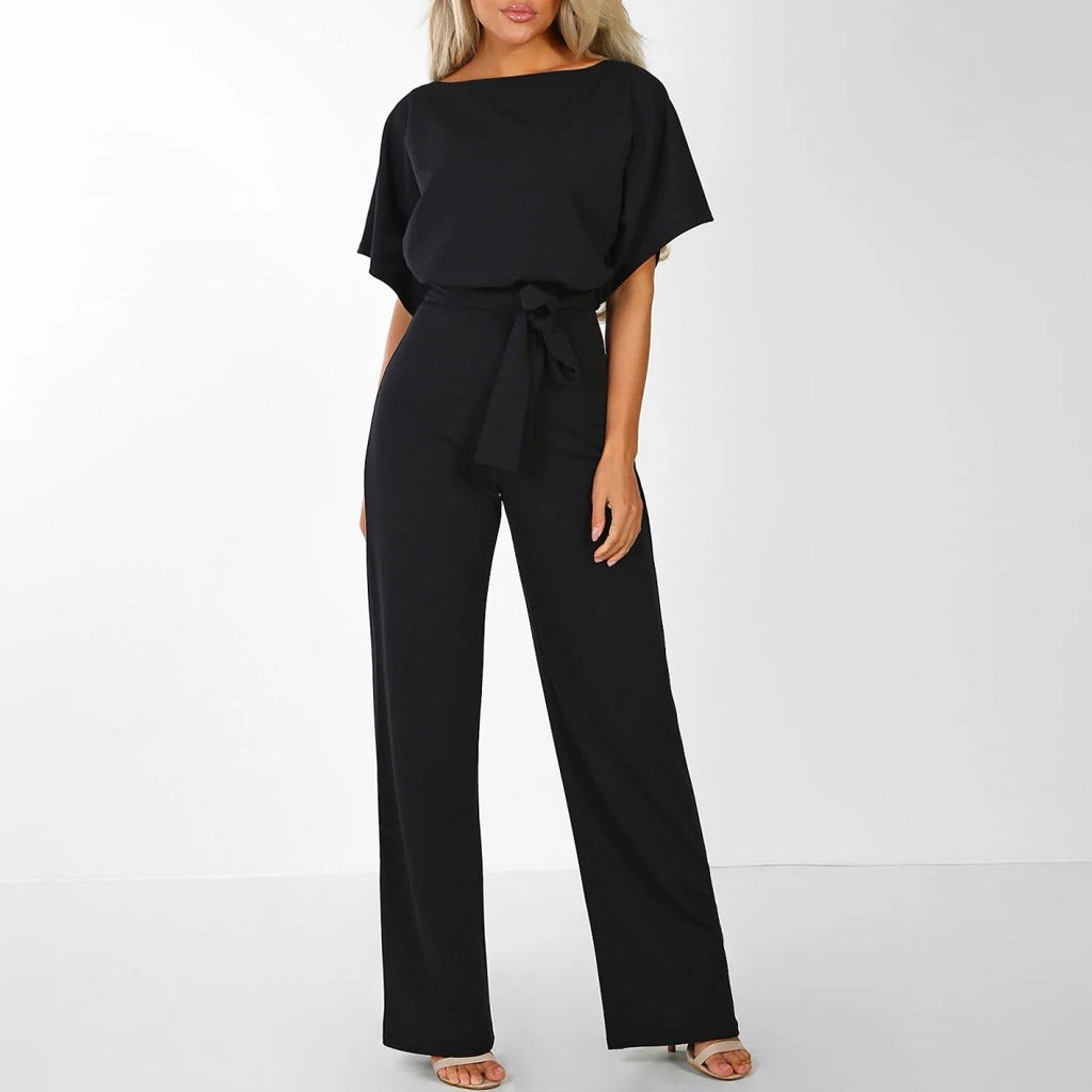 "Elegante Annette jumpsuit met lace-up taille, wijde broekspijpen in zwart. Tijdloze stijl en comfortabel in draagbare stof."