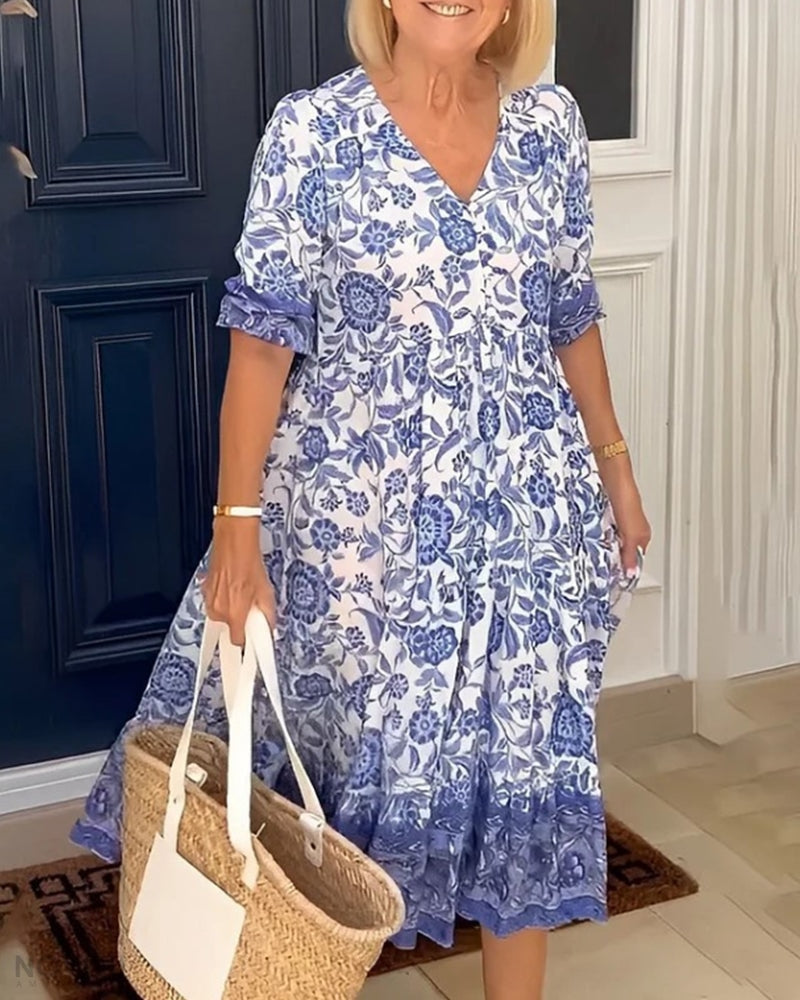 "Elegante bloemen maxi-jurk met V-hals en kleurrijk bloemenpatroon, perfect voor lente en zomer, damesjurken."