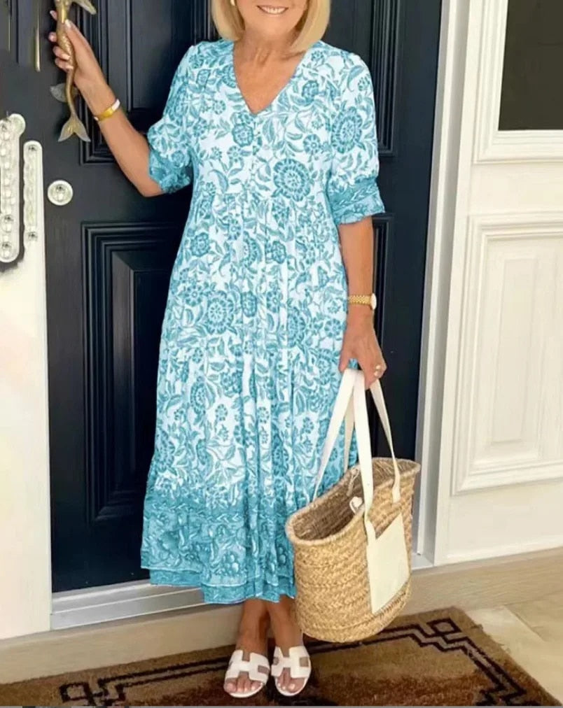 "Elegante bloemen maxi-jurk met V-hals en kleurrijk bloemenpatroon, perfect voor lente en zomer, damesjurken."