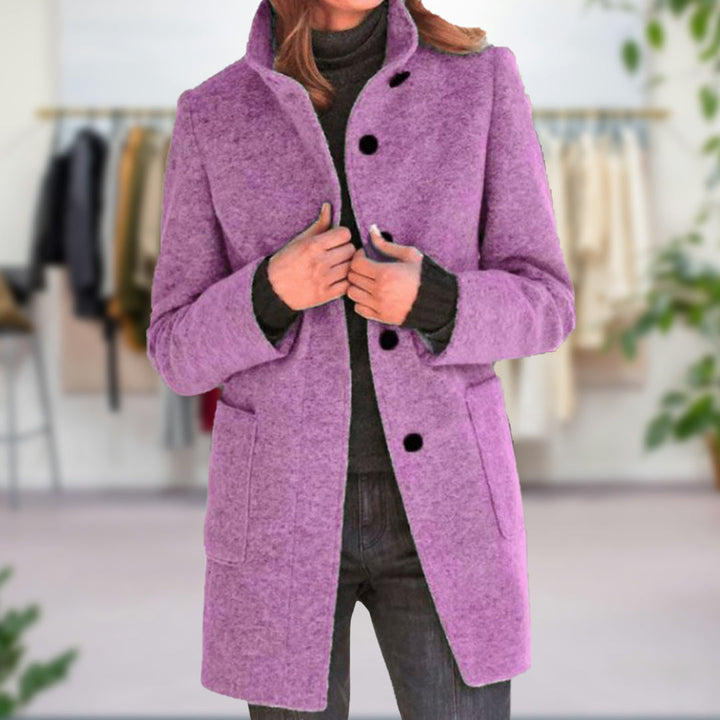 "Elegante dames herfstjas in grijze tint, biedt superieure warmte en stijlvolle afwerking voor koude dagen."