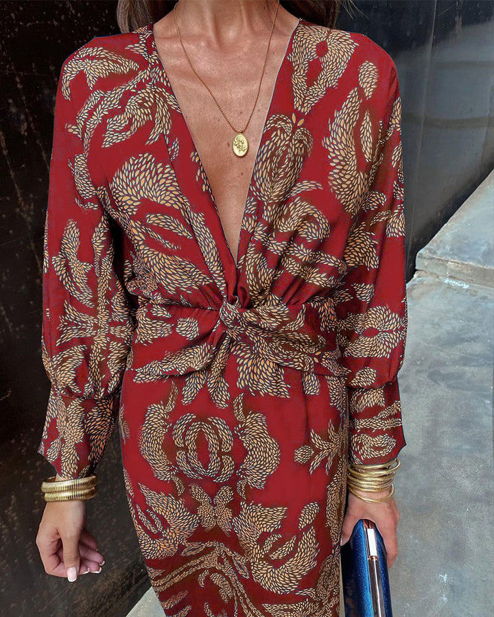 "Elegante dames V-hals midi-jurk met bladerenprint en knoopdetails, lange lantaarnmouwen perfect voor zomerse dagen."