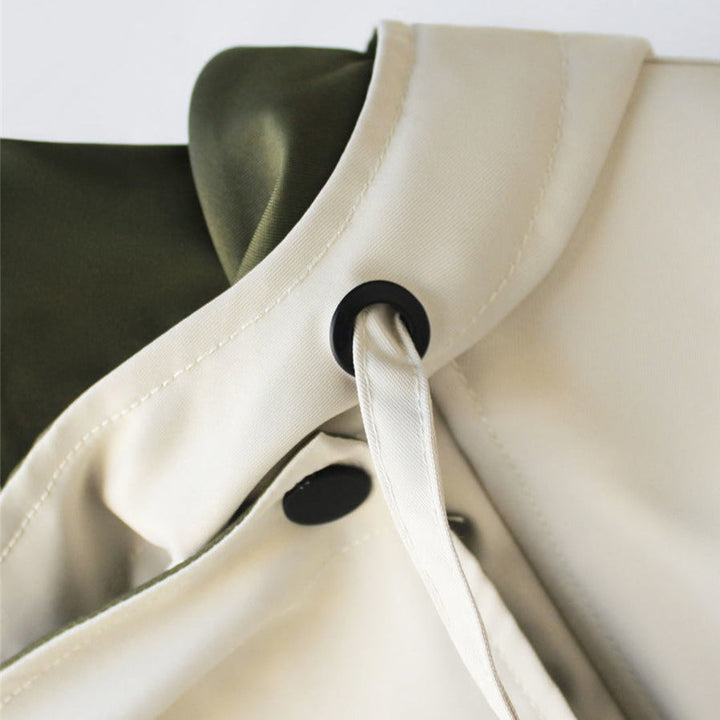 "Elegante dames winter trenchcoat, lange jas met dubbele kraag en weerbestendige afwerking."