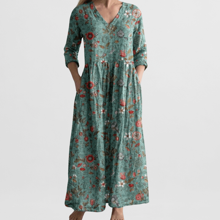 "Elegante dames zomerjurk met bloemenprint, vrouwelijke pasvorm, lichte stof, ideaal voor zonnige dagen en avondjes uit."