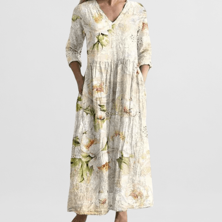 "Elegante dames zomerjurk met bloemenprint, vrouwelijke pasvorm, lichte stof, ideaal voor zonnige dagen en avondjes uit."