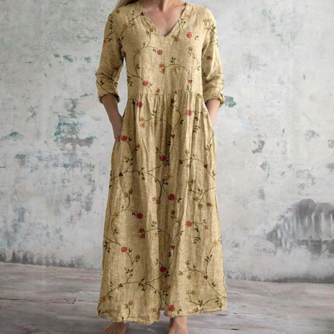 "Elegante dames zomerjurk met levendige bloemenprint, luchtige stof, voorzijde weergave, ideaal voor warme dagen."