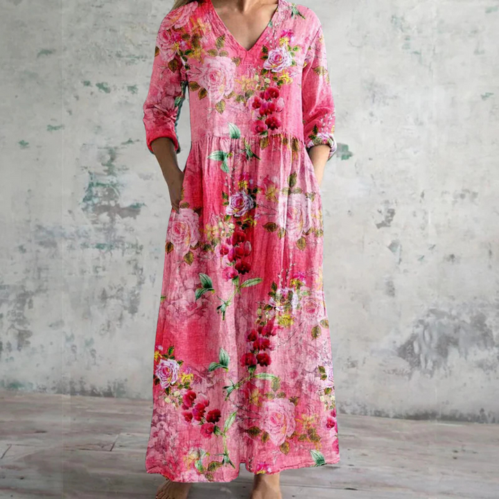 "Elegante dames zomerjurk met levendige bloemenprint, luchtige stof, voorzijde weergave, ideaal voor warme dagen."