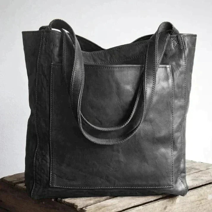 Elegante leren schoudertas voor dames, bruine kleur, met tijdloze uitstraling en royale binnenruimte, geschikt voor elke gele