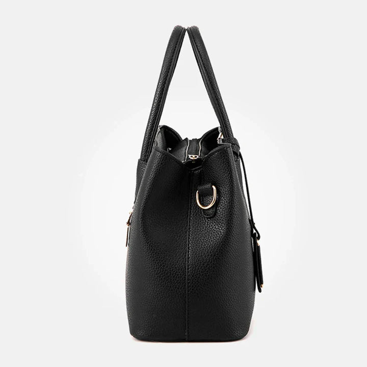 Elegante leren schoudertas voor dames, stijlvol en ruim, met verstelbare riem en verschillende kleurkeuzes.