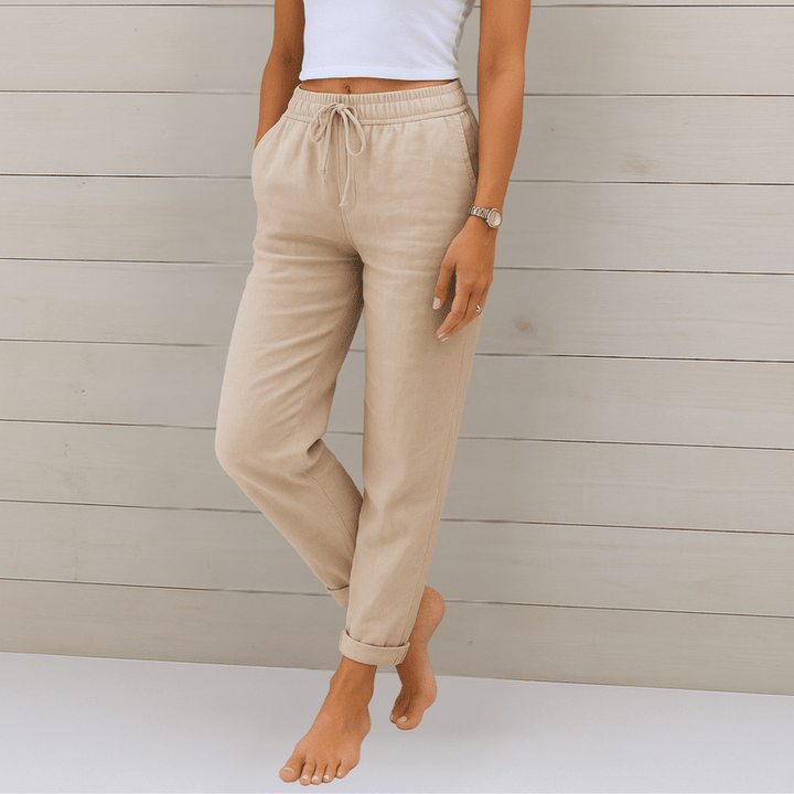 "Elegante linnen damesbroek, beige, ademend, comfortabele pasvorm, dagelijks gebruik. Zichtbaar: simpele ritssluiting."