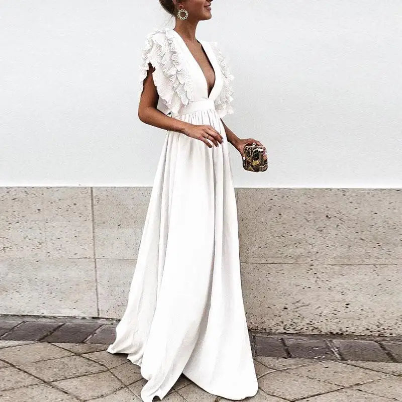 "Elegante Liva jurk met gerimpelde mouwen, tijdloze stijl, luxe stoffen, perfect voor speciale gelegenheden."