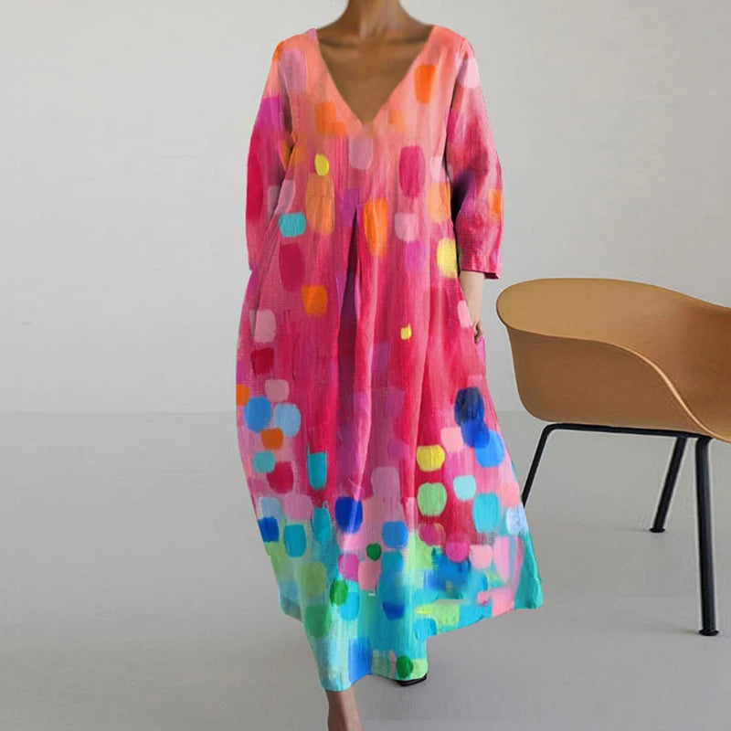 "Elegante maxi jurk met abstracte bloemenprint, bohemian stijl, lange mouwen, zakken, V-hals, perfect voor zomerdagen."
