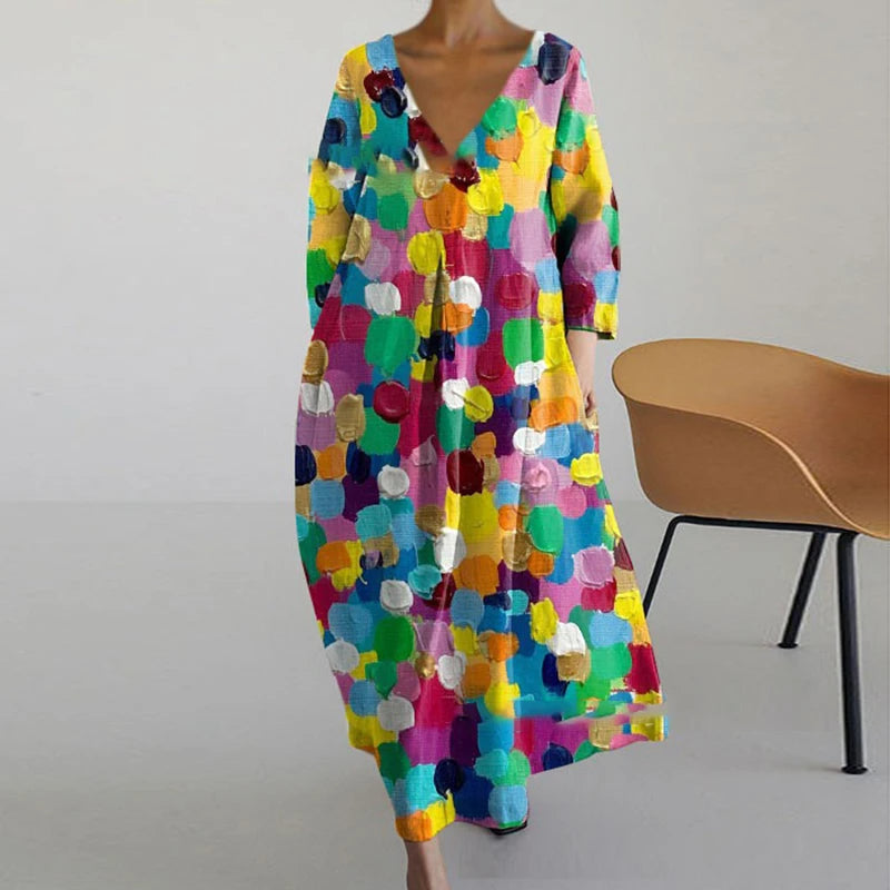"Elegante maxi jurk met abstracte bloemenprint, bohemian stijl, lange mouwen, zakken, V-hals, perfect voor zomerdagen."
