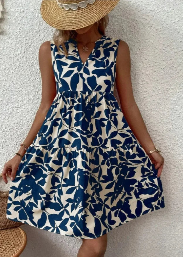 Elegante midi-jurk met V-hals, zomerse bloemenprint, luchtige stof, mouwloos, ideaal voor warme dagen en stijlvolle uitstrali