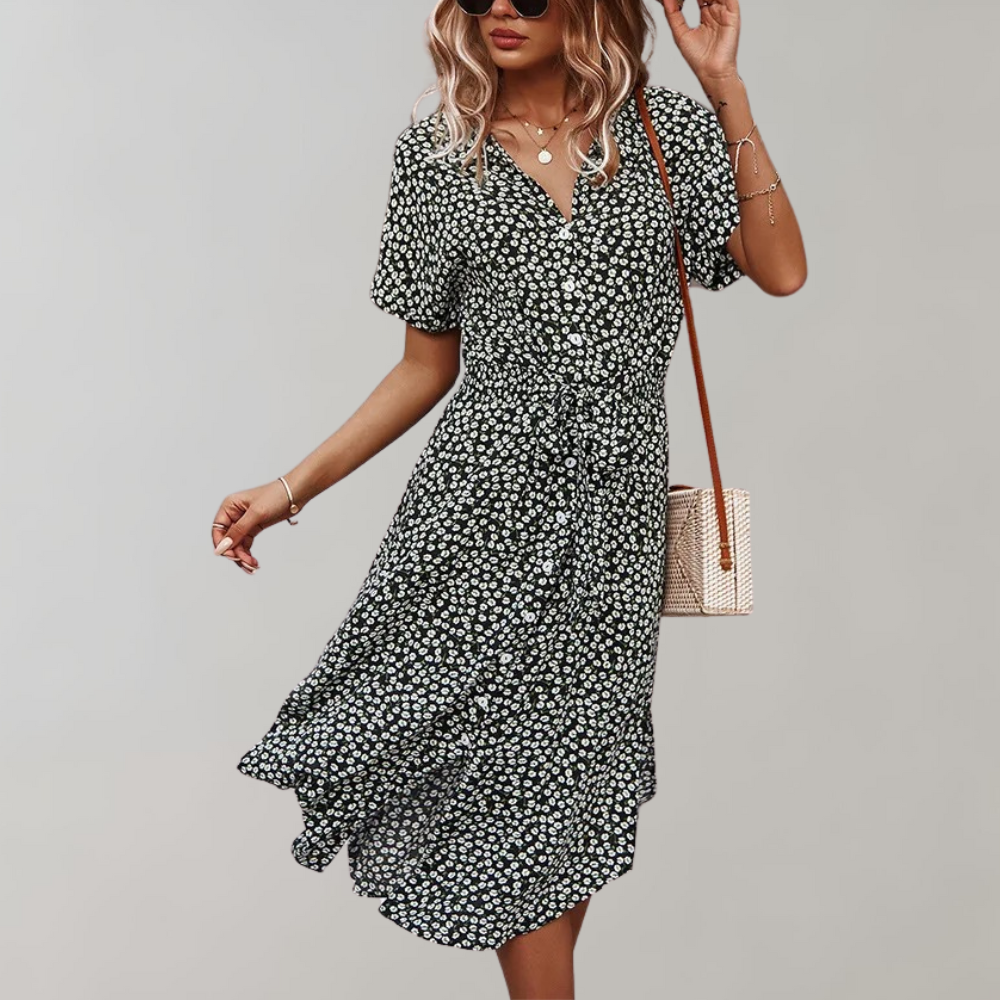 "Elegante midi zomerjurk met bloemenprint en korte mouwen, perfect voor damesmode in zowel casual als formele settings."
