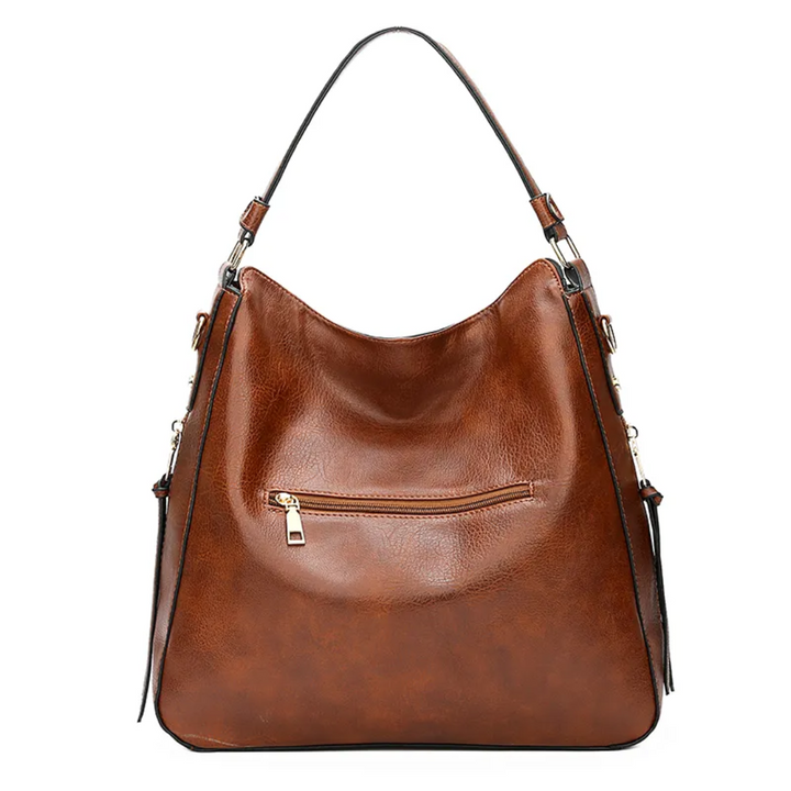 "Elegante rode hobo tas voor dames met vintage charme, ruim interieur, ideaal voor dagelijks gebruik in stijl."