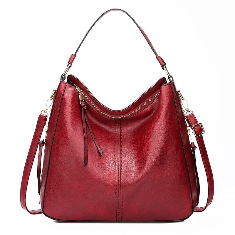 "Elegante rode hobo tas voor dames met vintage charme, ruim interieur, ideaal voor dagelijks gebruik in stijl."